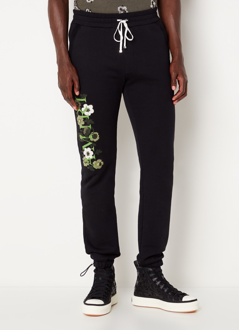 AMIRI - Tapered fit joggingbroek met bloemenprint - Zwart