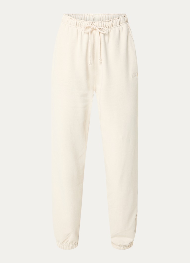 New Balance Dames High waist tapered fit joggingbroek met steekzakken in de kleur Gebroken wit, maat: S
