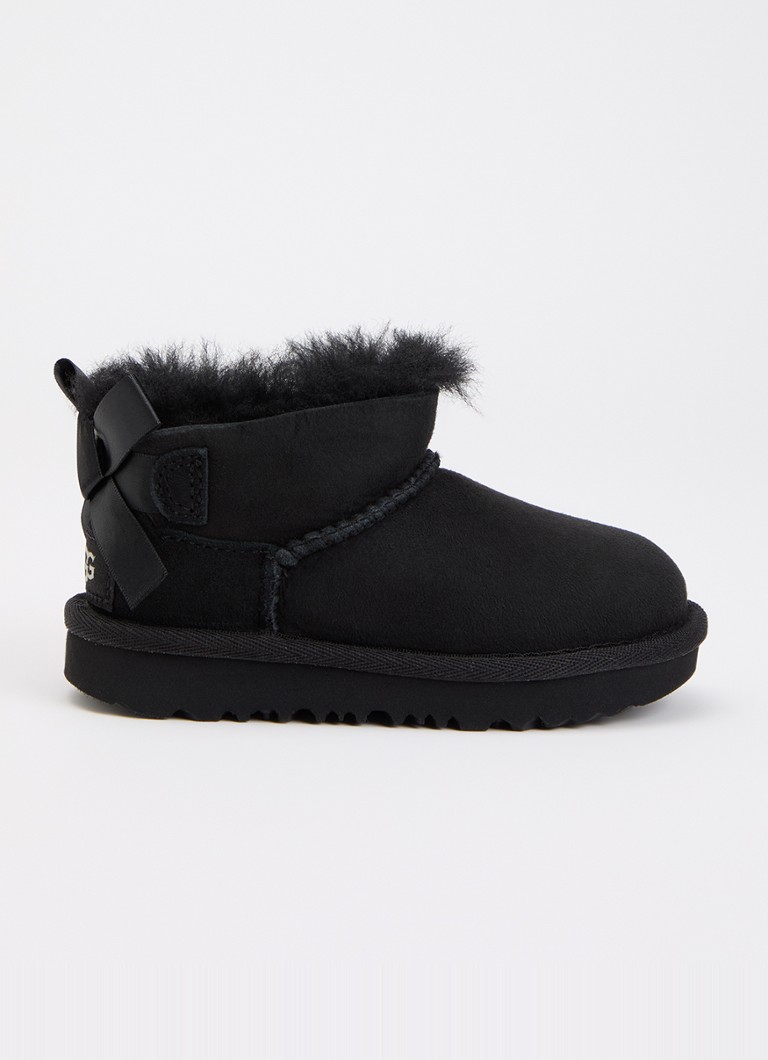 UGG Meisjes Ultra Mini Bailey Bow enkellaarsje van suède in de kleur Zwart, maat: 26