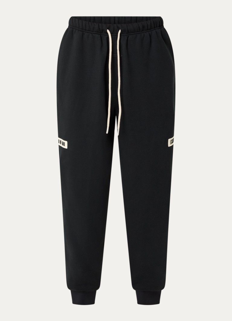 Fear of God Essentials Heren Tapered fit joggingbroek met logo en steekzakken in de kleur Zwart, maat: XS
