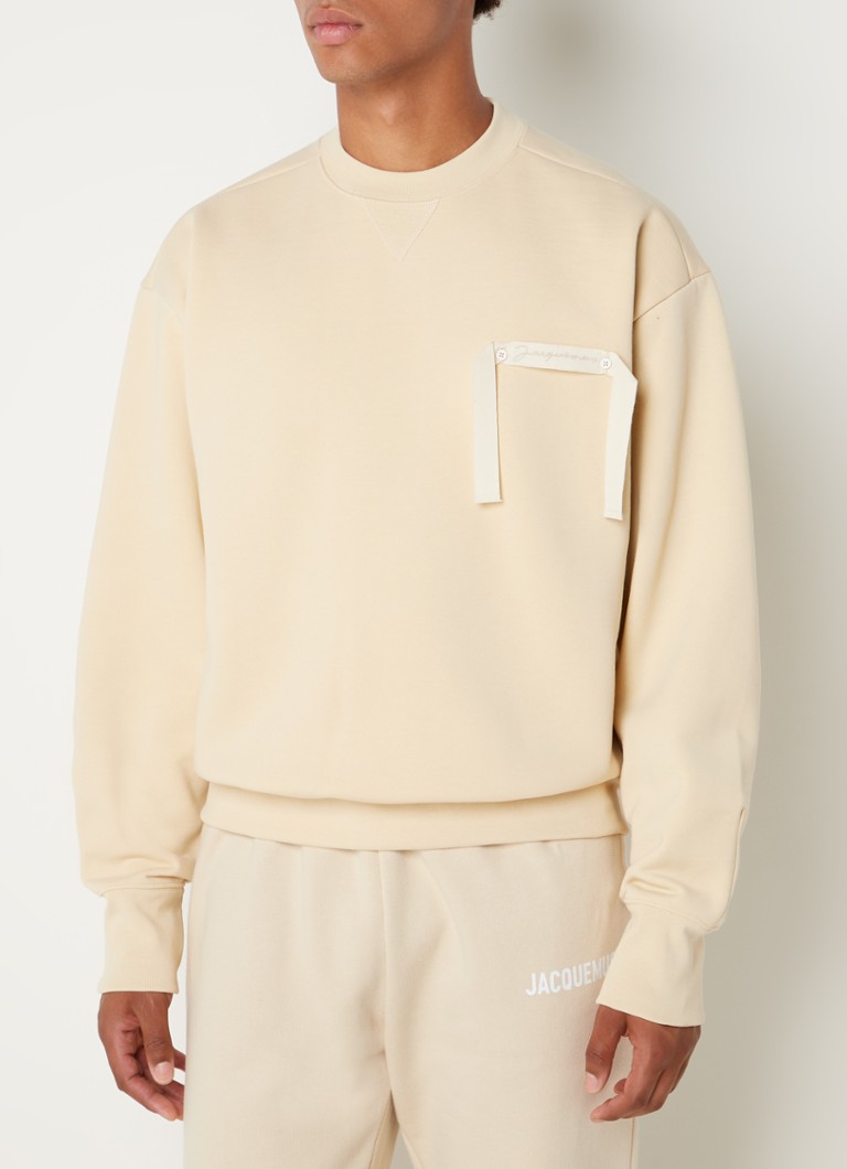 spleet Verslinden excuus Jacquemus Le Sweatshirt oversized sweater met logo • Beige • de Bijenkorf