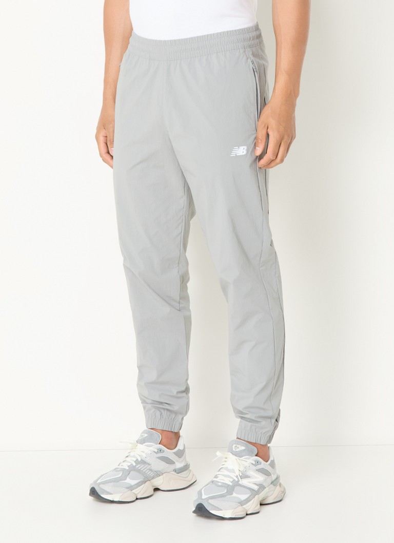 New Balance - Tapered fit joggingbroek met ritszakken - Grijs