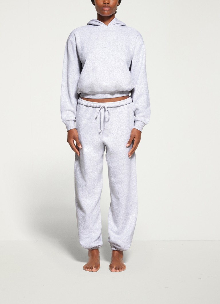 SKIMS - Cotton Fleece hoodie met kangoeroezak - Grijsmele
