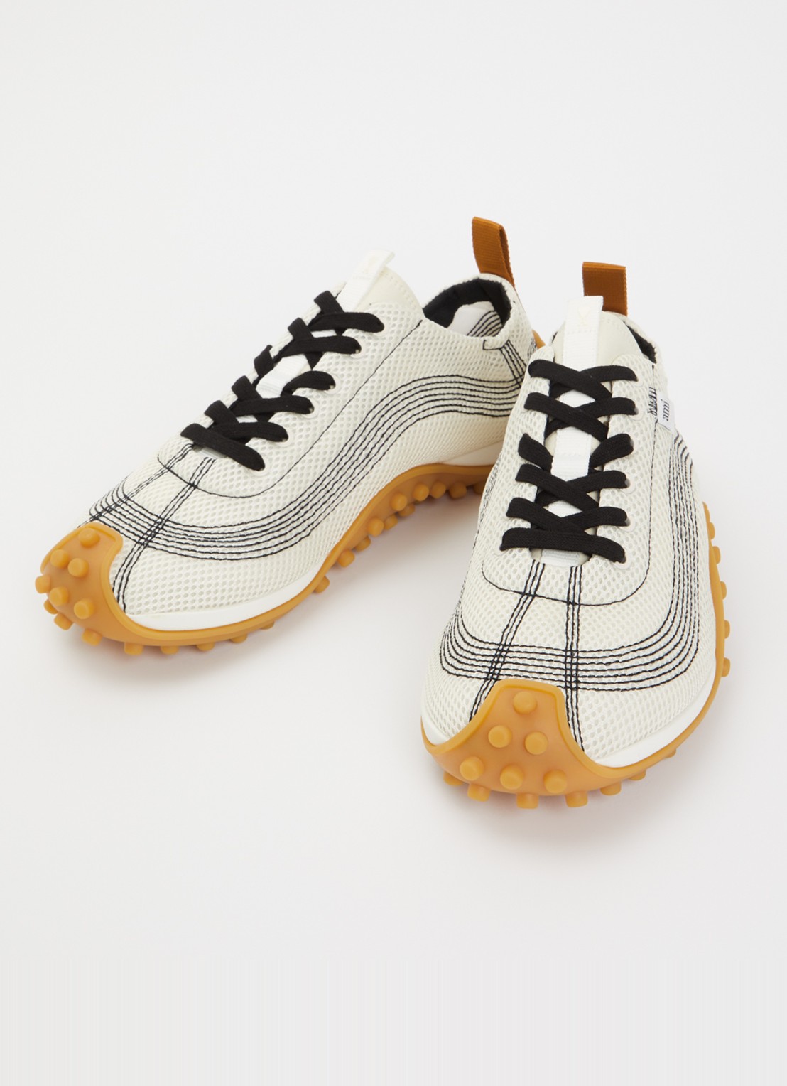 AMI Paris Mirage sneaker met schapenleren details - detail ivoor