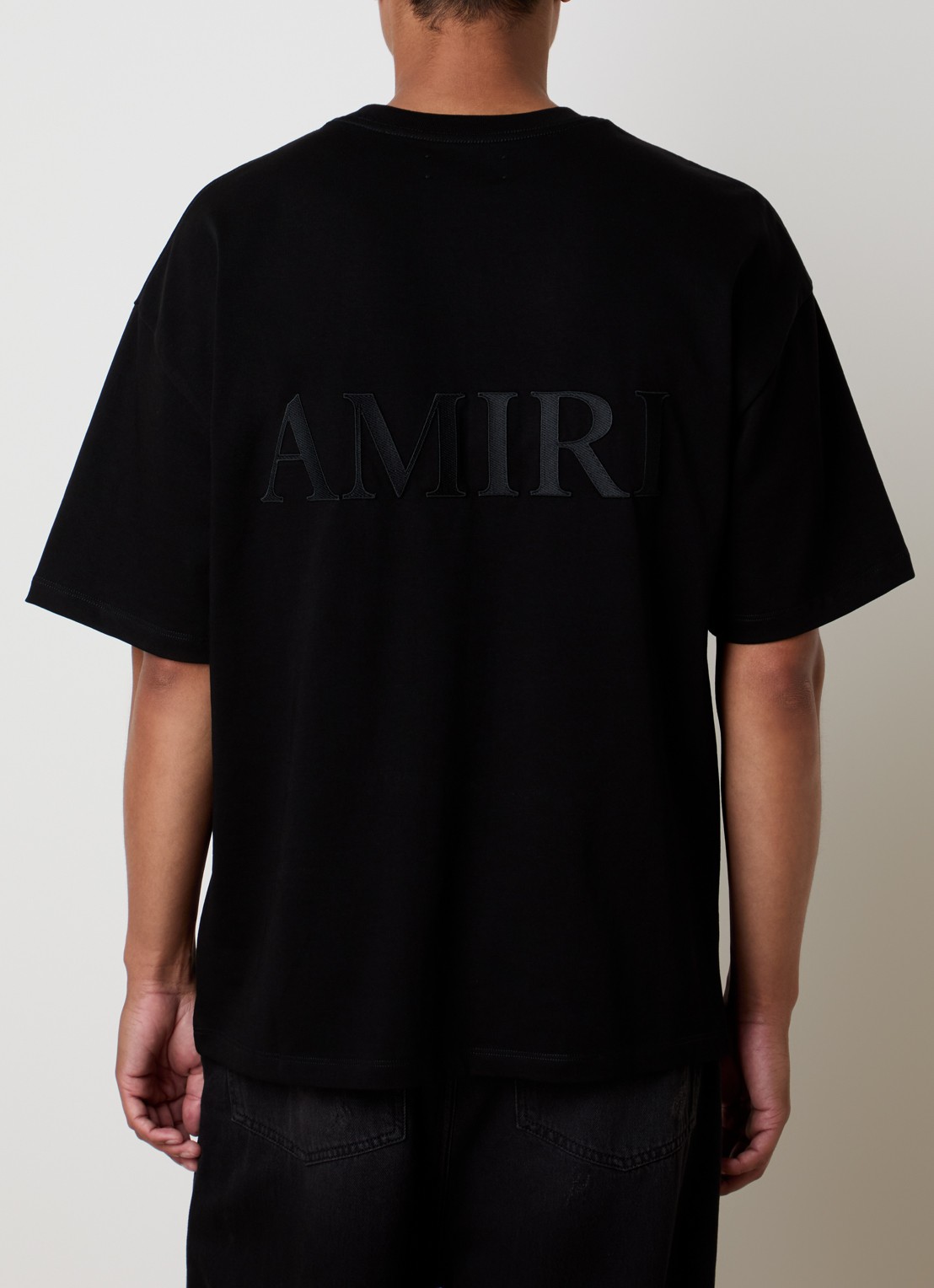 AMIRI Oversized T-shirt met logo- en backprint - detail zwart