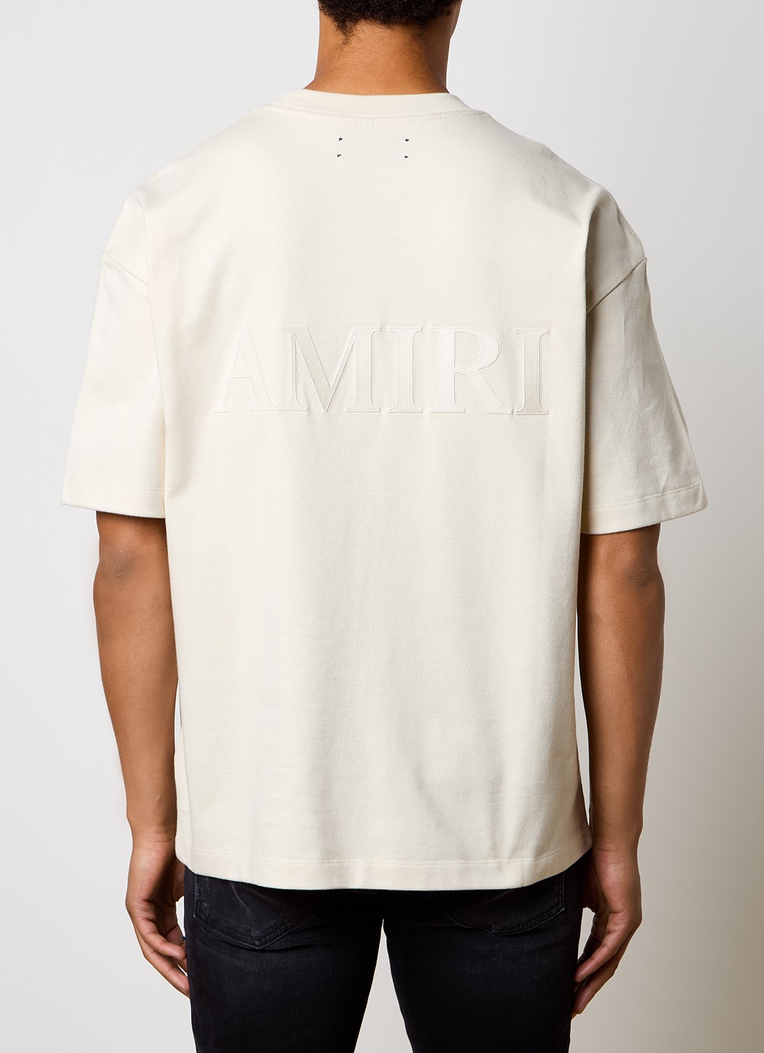AMIRI Oversized T-shirt met logo- en backprint - detail gebroken wit