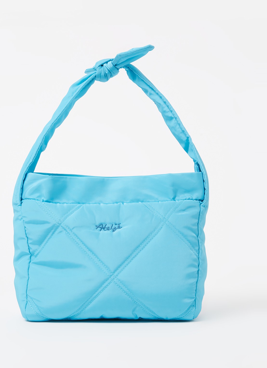 Ateljé Bow schoudertas met quilt patroon - voorkant aquablauw