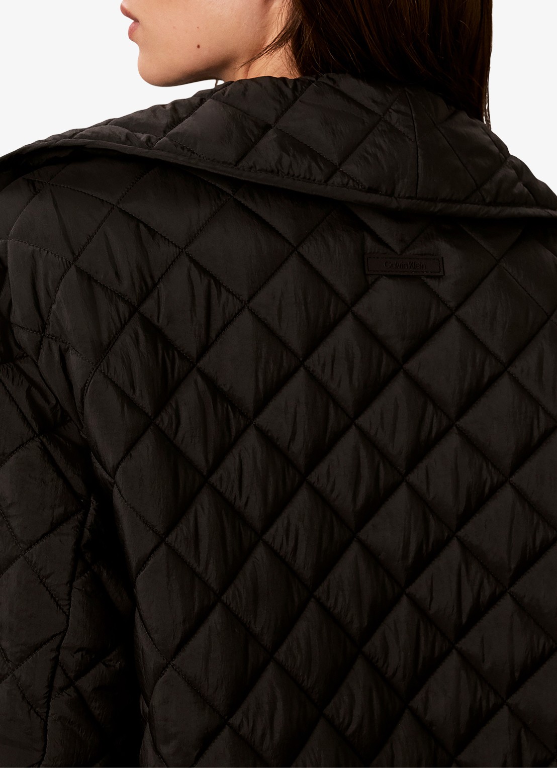 Calvin Klein Mantel met quilt patroon en paspelzakken - detail zwart