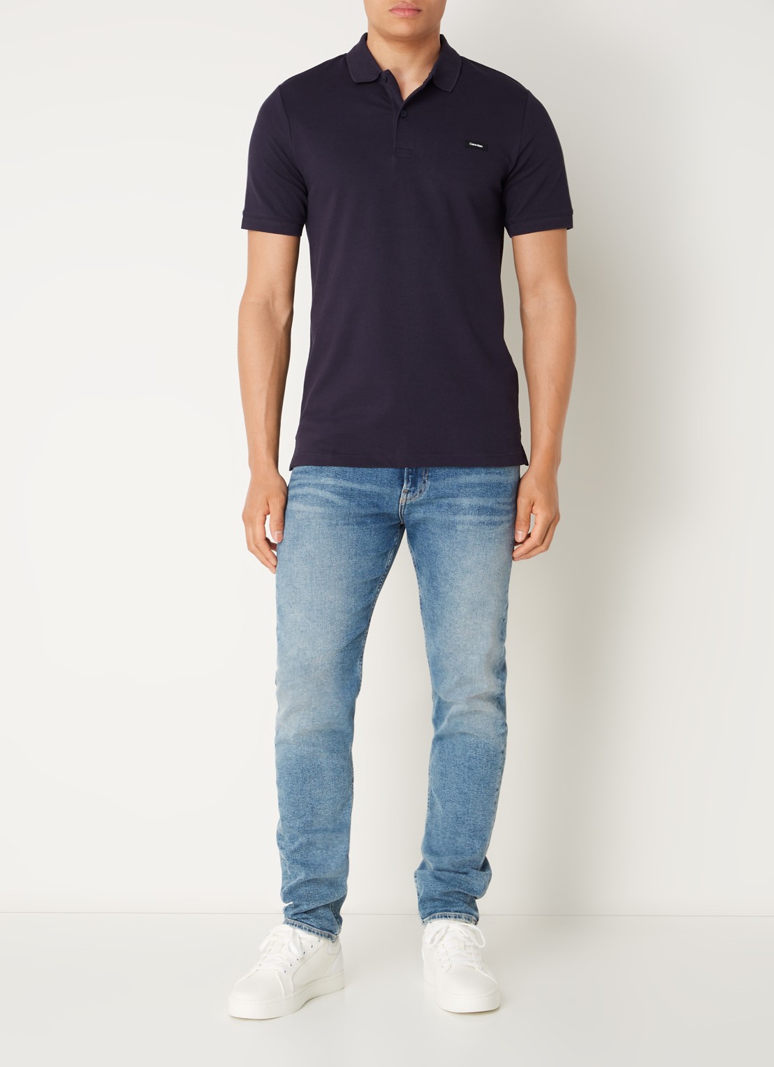 Calvin Klein Slim fit polo van piqué katoen met logo - voorkant 3 donkerblauw