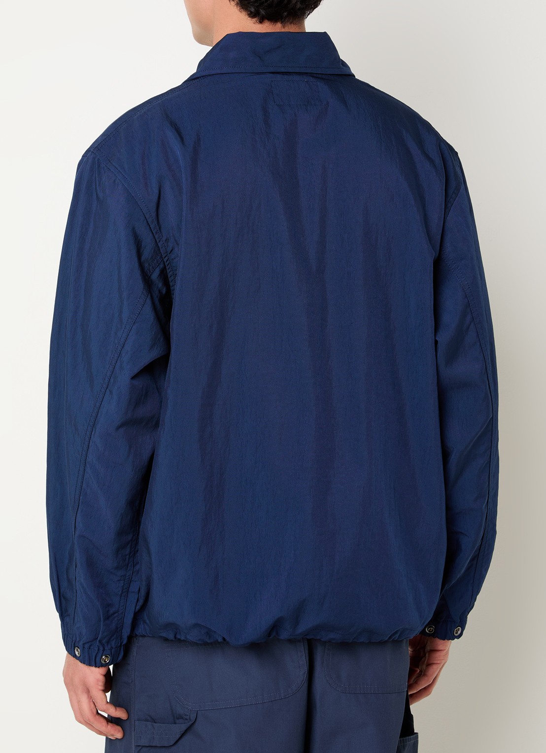 Carhartt WIP Eightynine Coach softshell jack met steekzakken - achterkant indigo