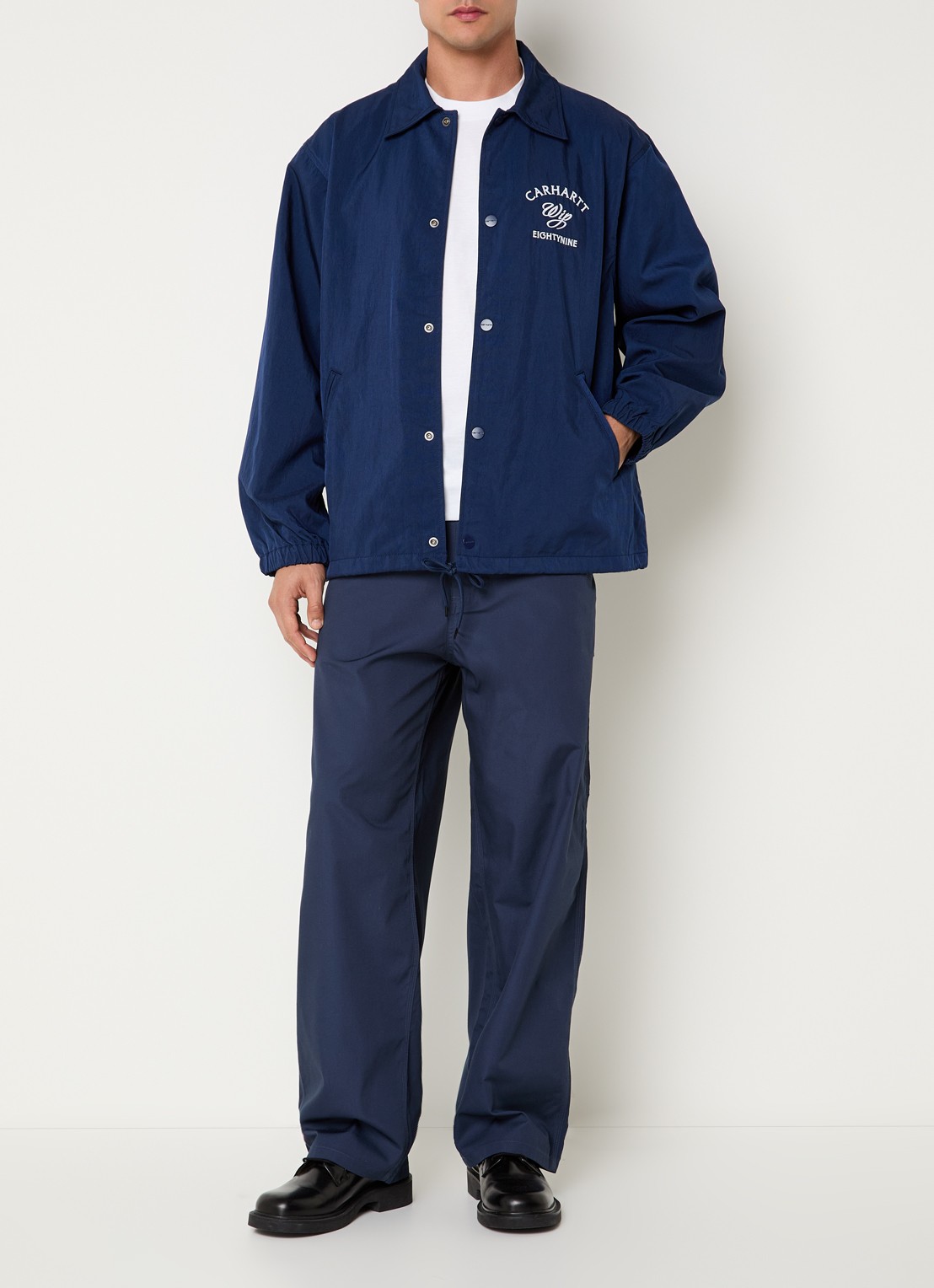 Carhartt WIP Eightynine Coach softshell jack met steekzakken - voorkant 4 indigo