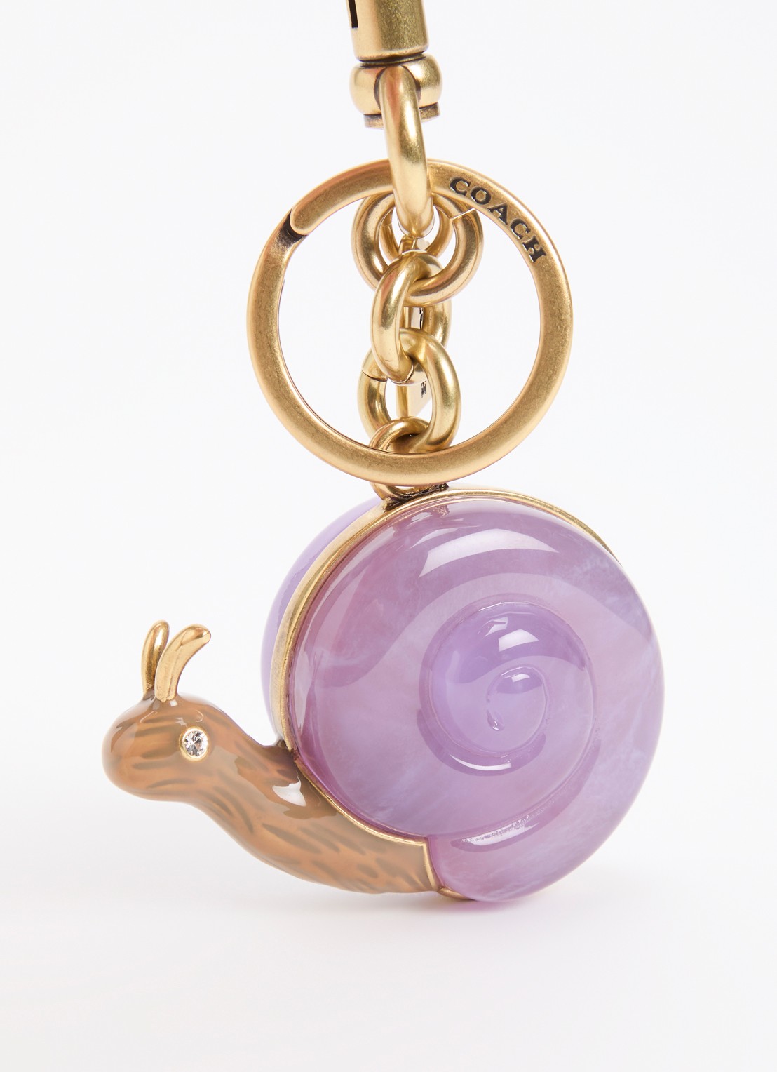 Coach Snail tasbedel - detail goud