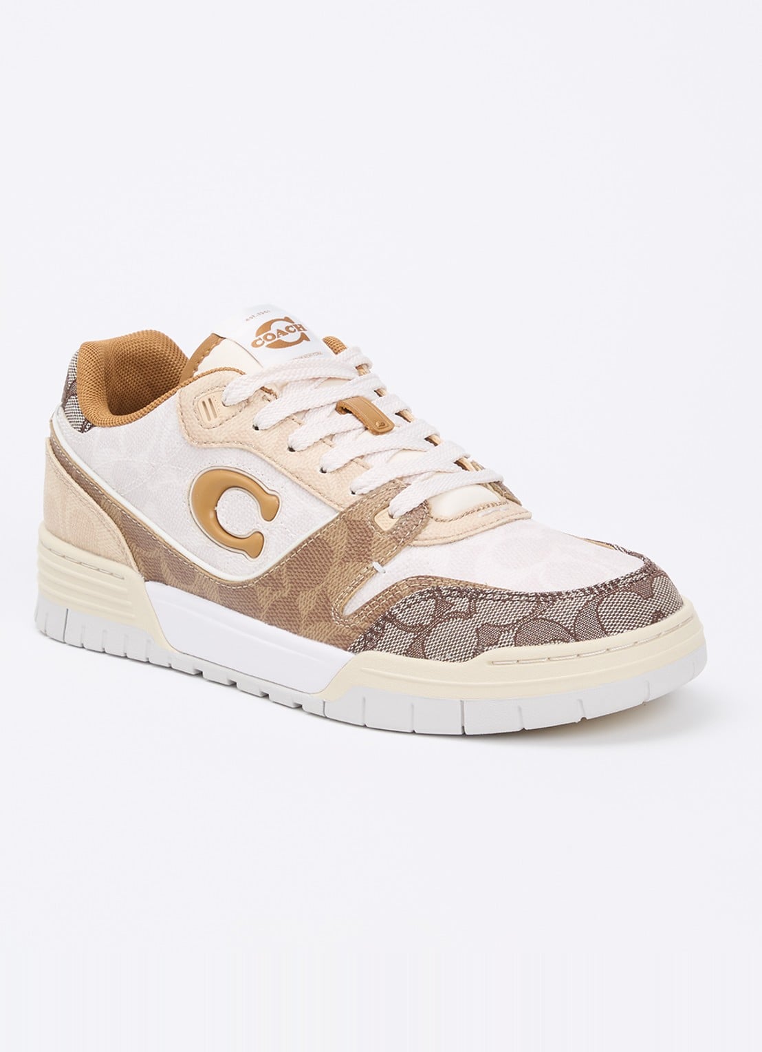Coach Soho sneaker van leer met logoprint - voorkant beige
