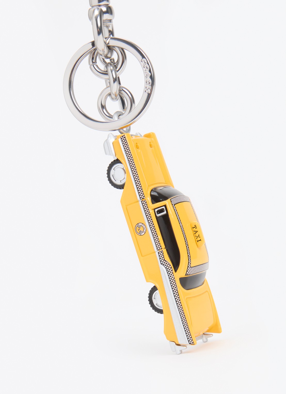 Coach Taxi tasbedel - detail geel
