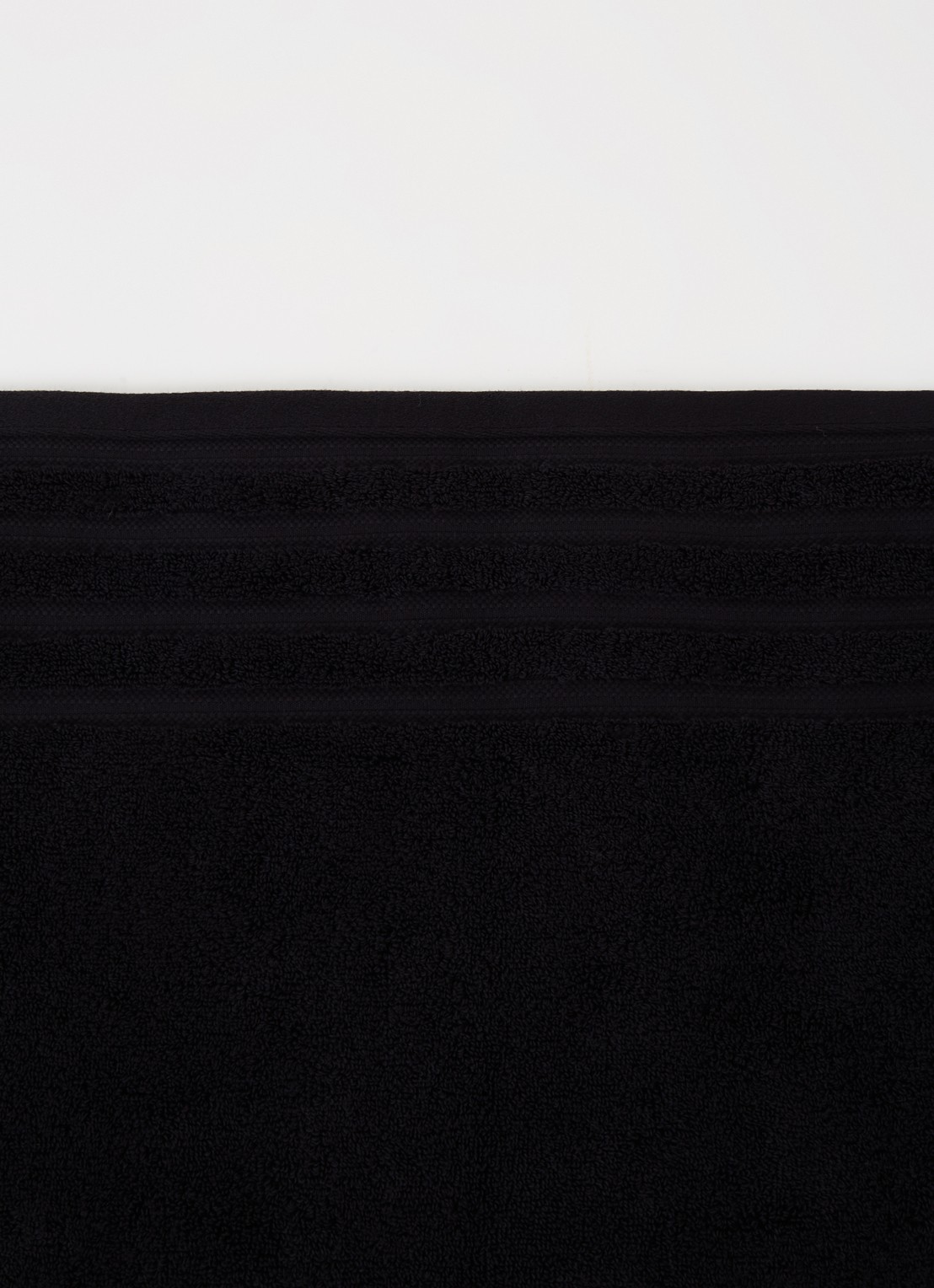 de Bijenkorf Home Evolution badlaken - 580 gr/m2 - 100 x 150 cm - voorkant 2 zwart