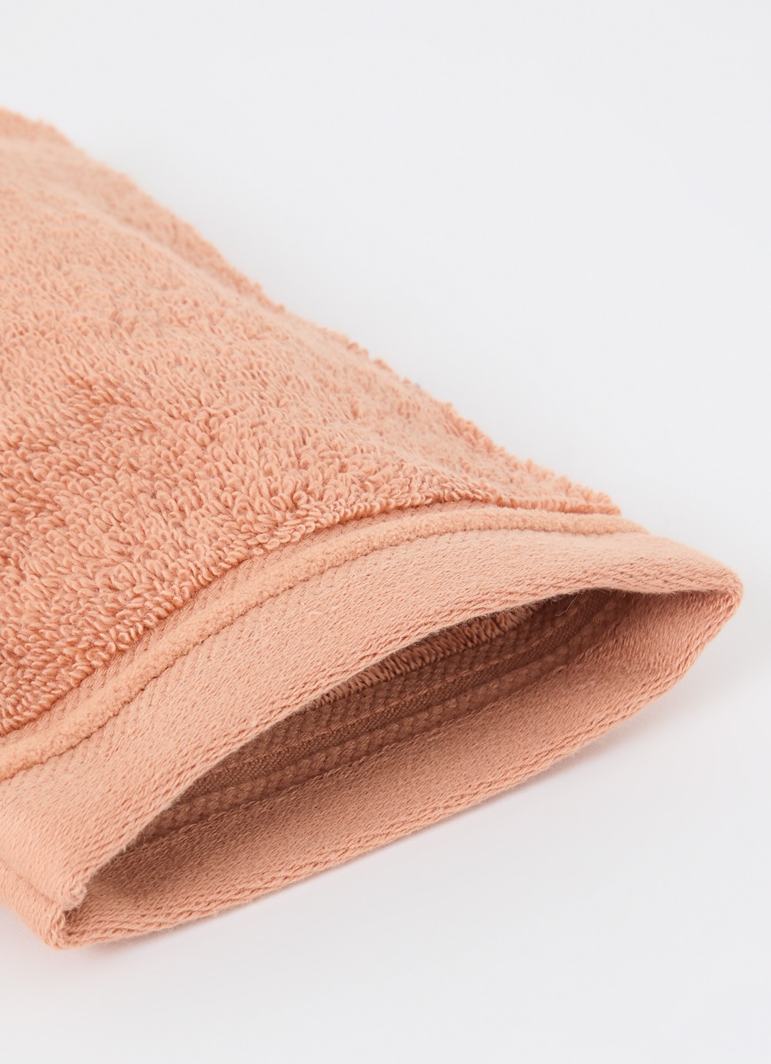 de Bijenkorf Home Evolution washand- 580 gr/m2 - 16 x 21 cm set van 2 - detail oranjebruin
