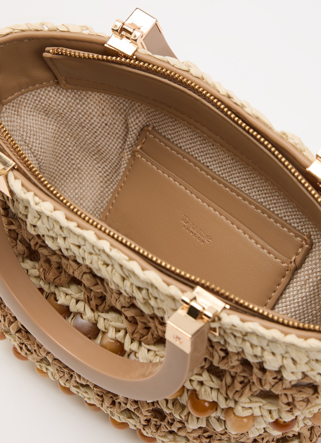 Dune London Dahlia handtas van raffia met afneembare schouderriem - detail beige