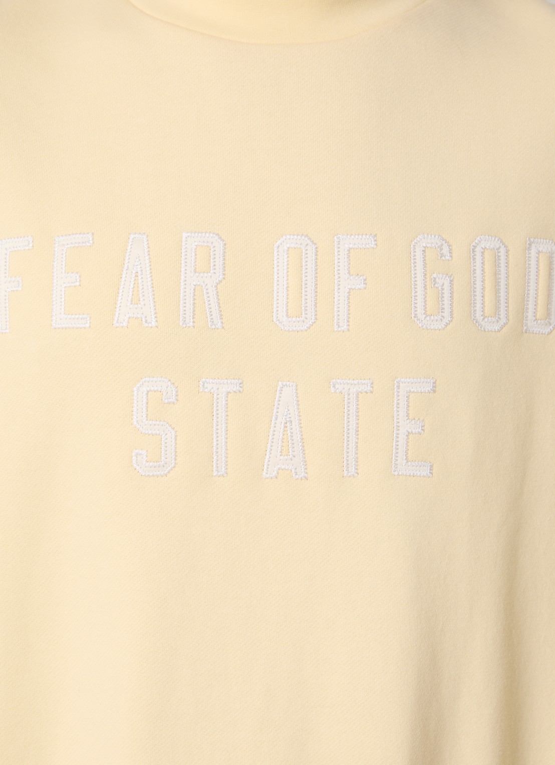 Fear of God Essentials Sweater met logoborduring - detail 2 lichtgeel
