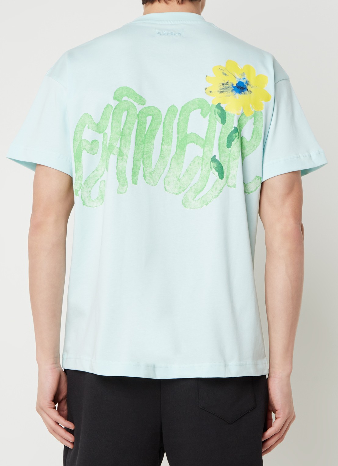 FLÂNEUR Tortuous T-shirt met logo- en backprint - detail mint