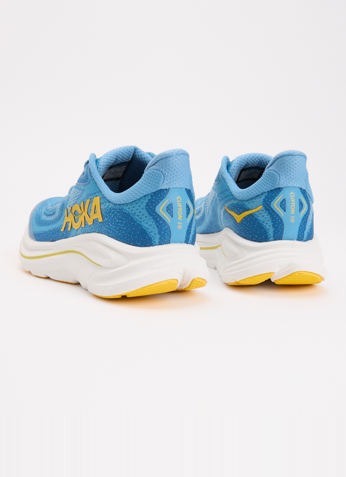 HOKA Clifton 10 hardloopschoen met gebreid bovenwerk en logo - achterkant blauw