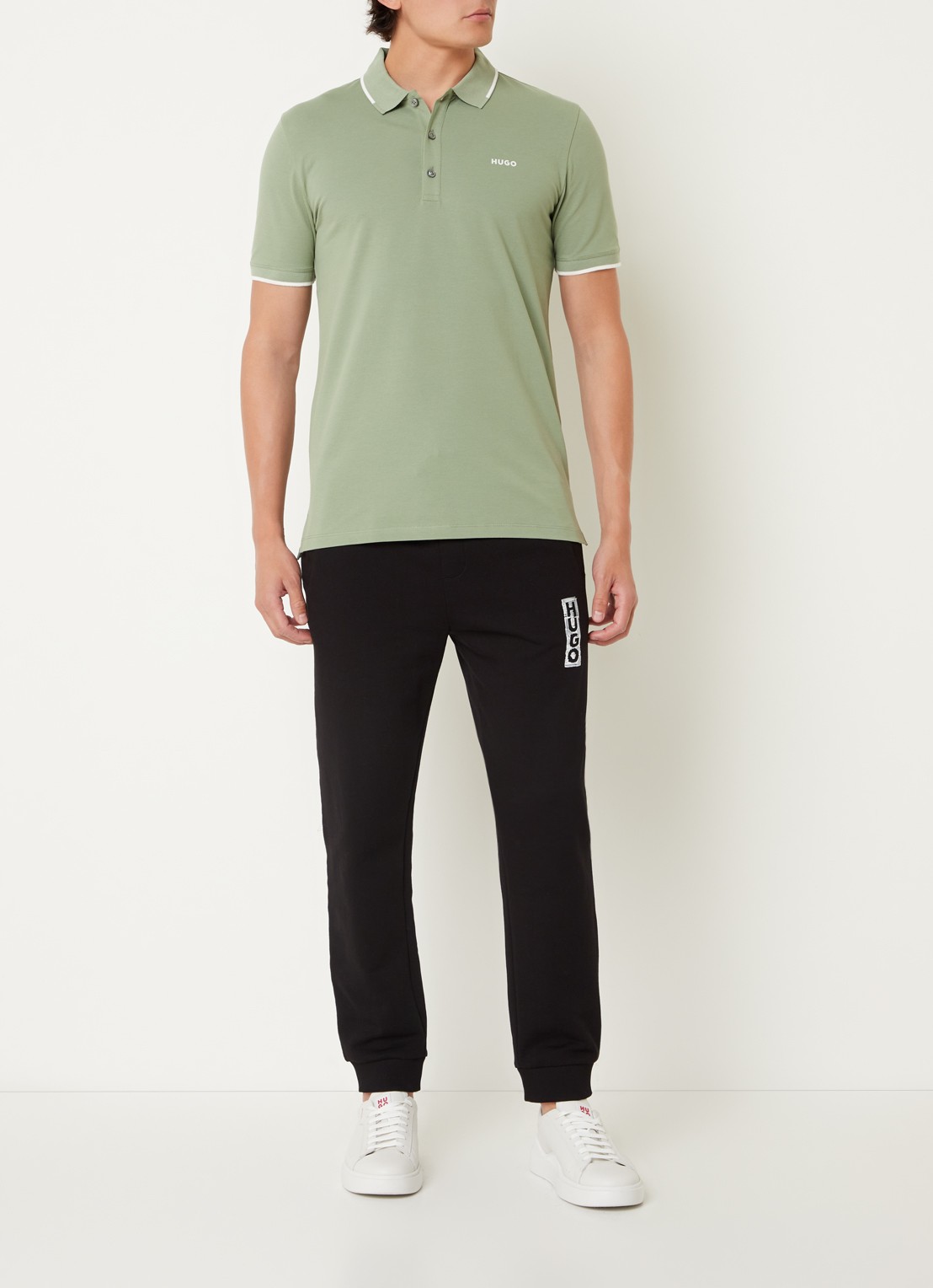HUGO Dinoso slim fit polo van piqué katoen met logo - voorkant 3 lindegroen