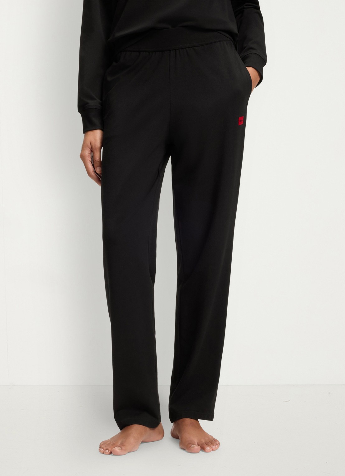HUGO Mid waist wide fit lounge joggingbroek met logo - detail zwart