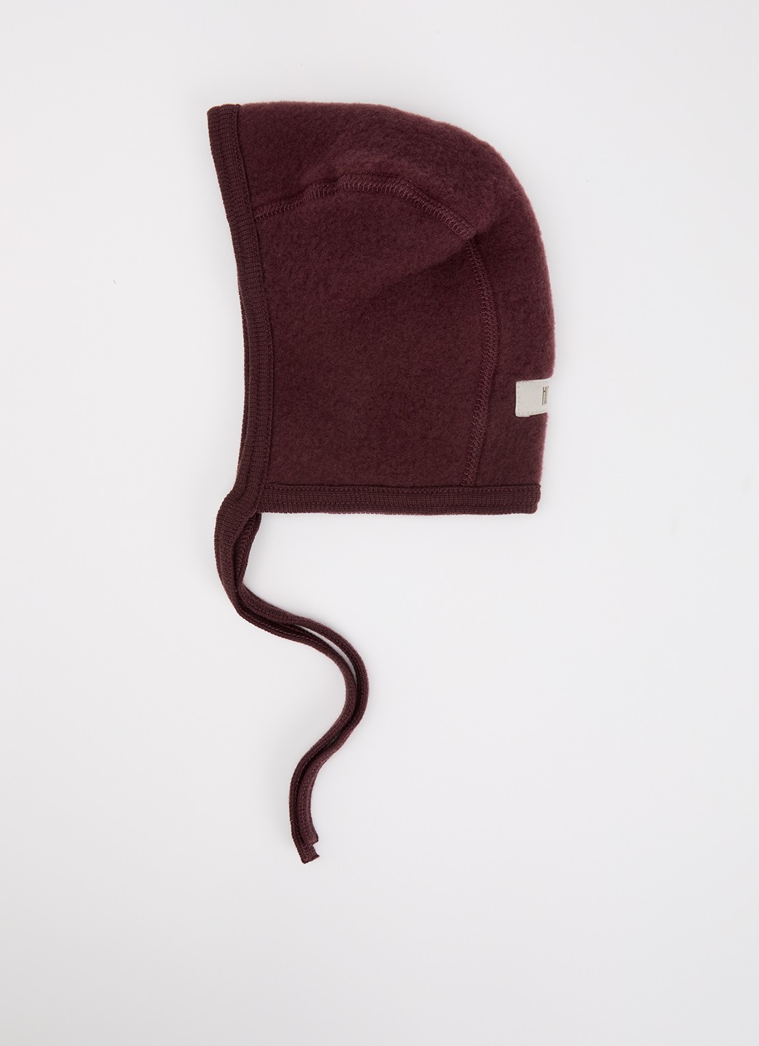 Huttelihut Babymuts van merino wol - voorkant aubergine