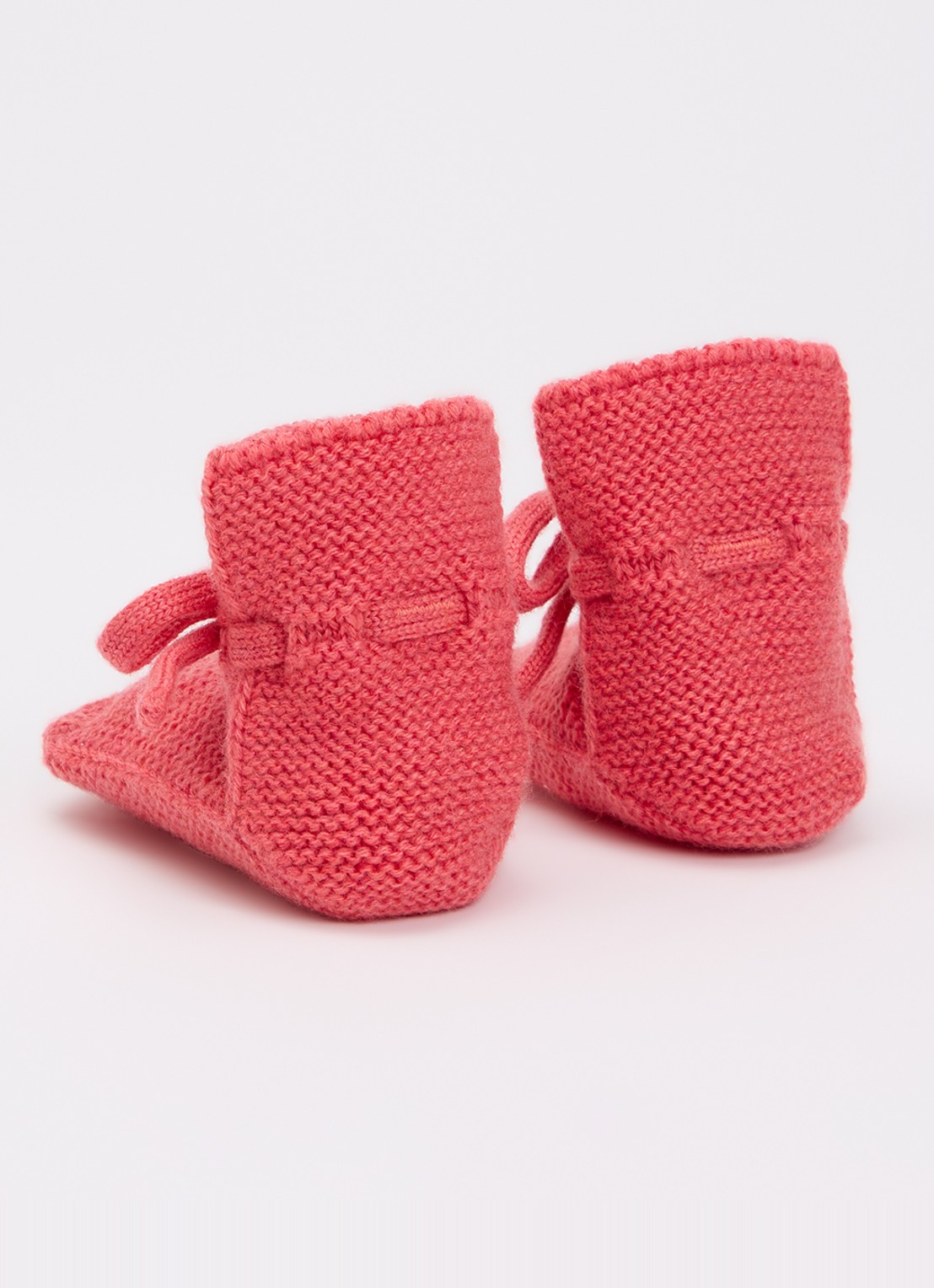 Hvid Babyslofjes van merino wol - achterkant donkerroze