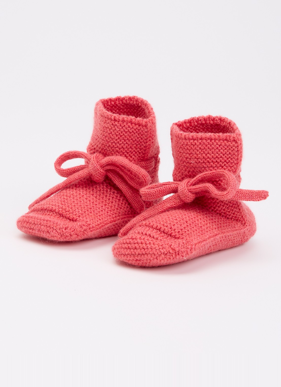 Hvid Babyslofjes van merino wol - voorkant 3 donkerroze