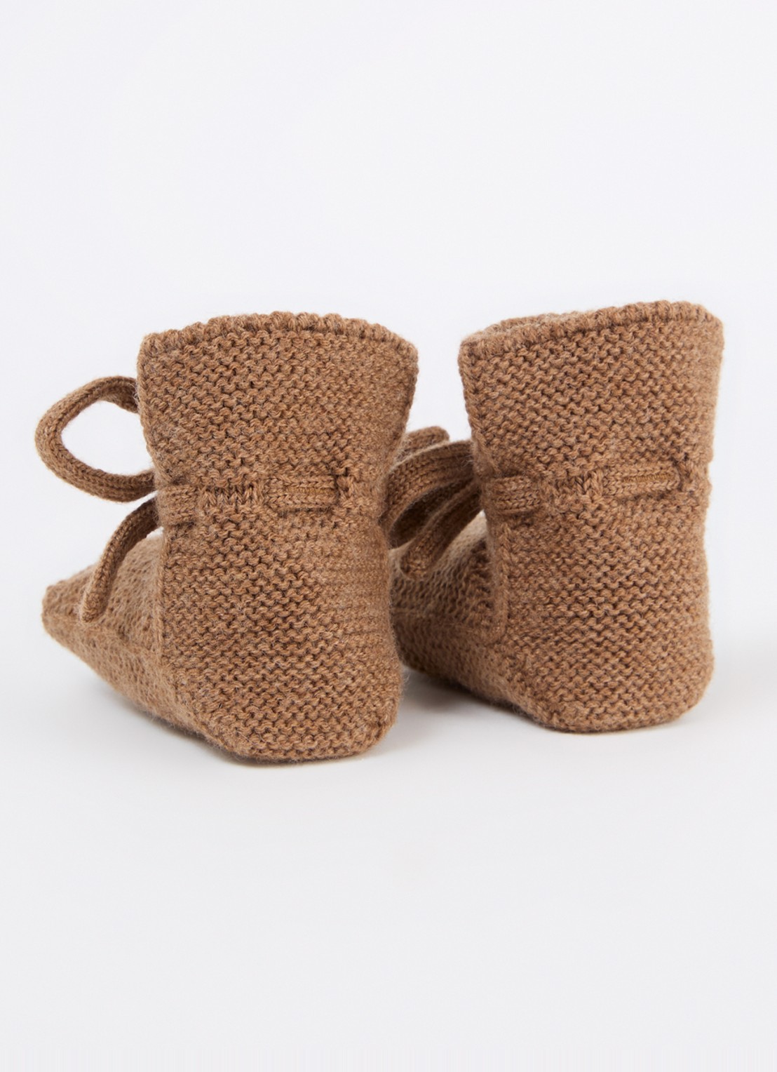 Hvid Babyslofjes van merino wol - achterkant bruin
