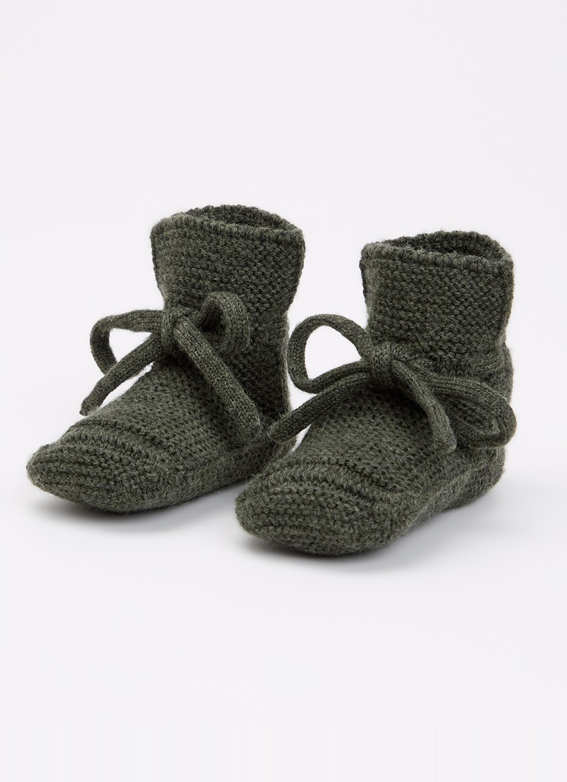Hvid Babyslofjes van merino wol - voorkant 4 donkergroen