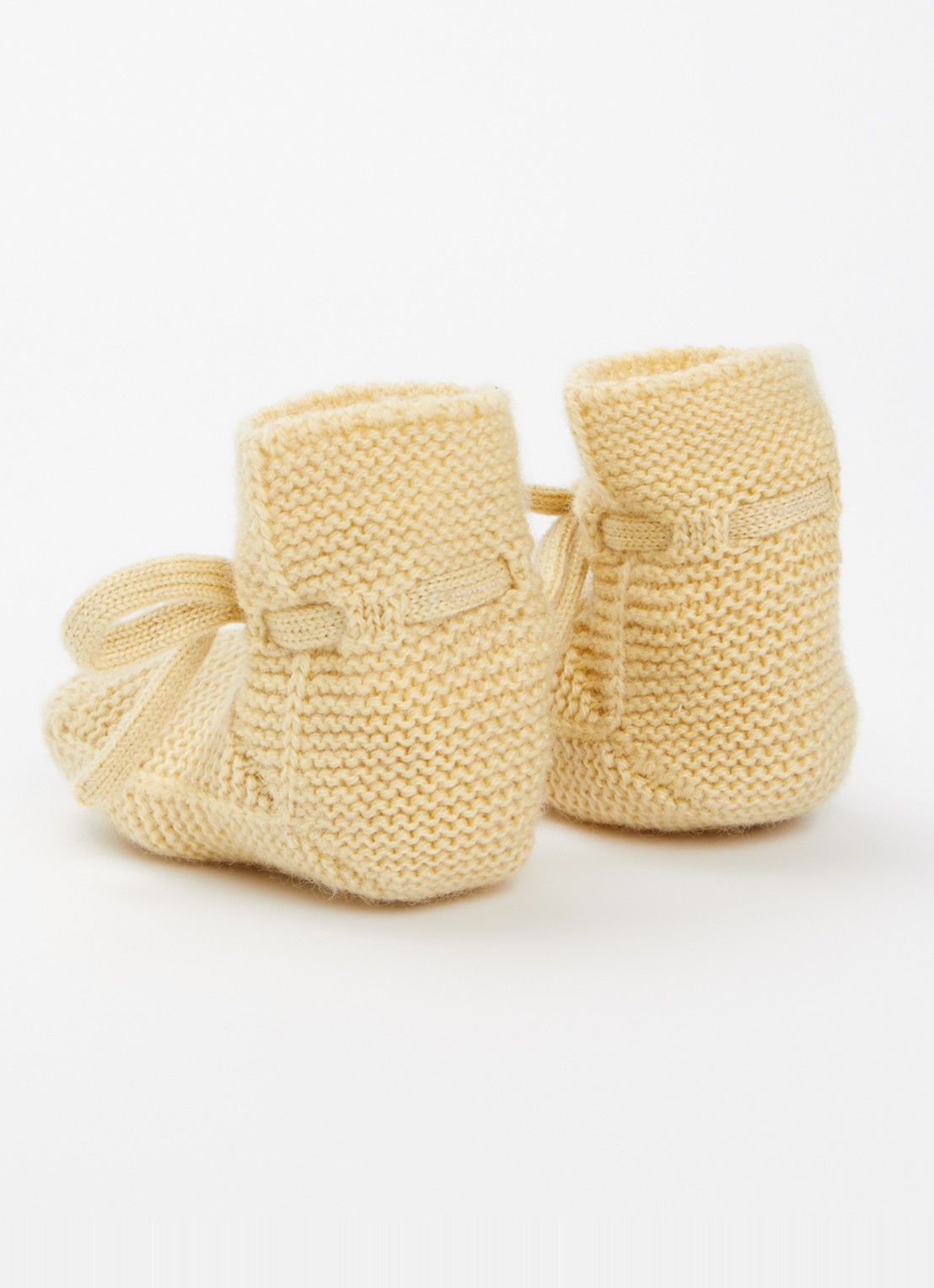 Hvid Babyslofjes van merino wol - achterkant 2 lichtgeel