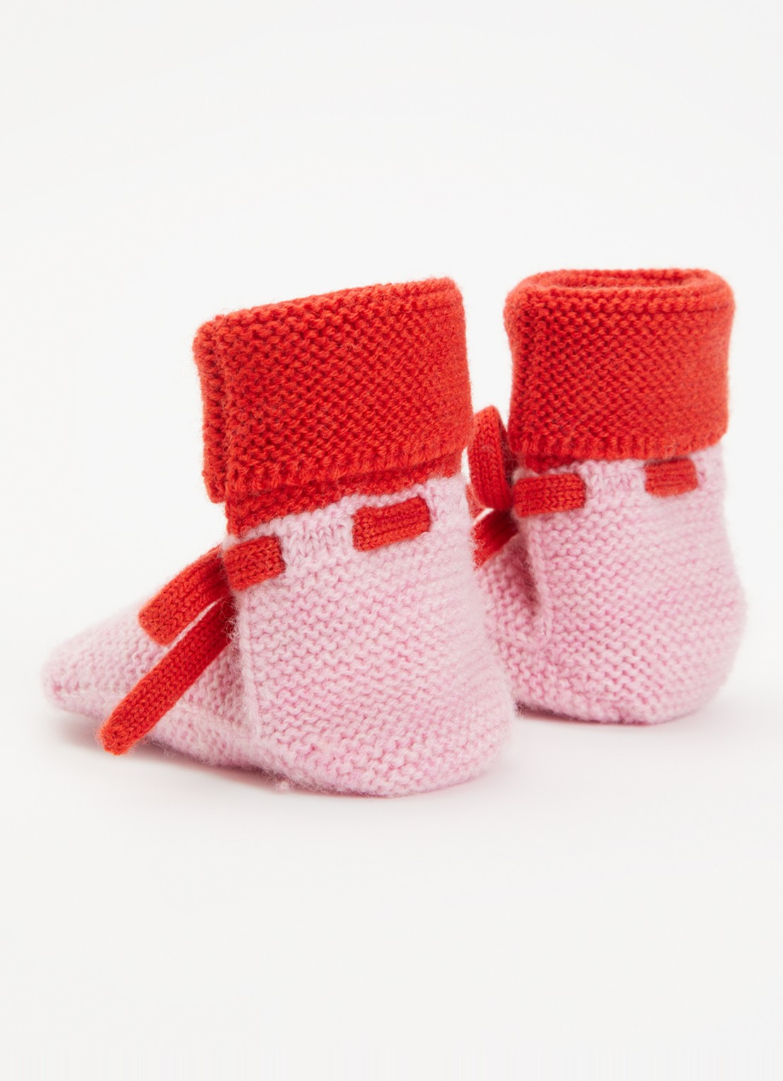 Hvid Babyslofjes van merino wol  - achterkant roze