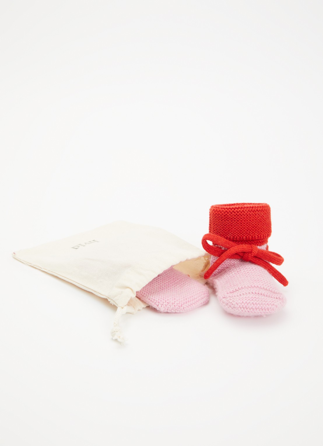 Hvid Babyslofjes van merino wol  - detail 2 roze
