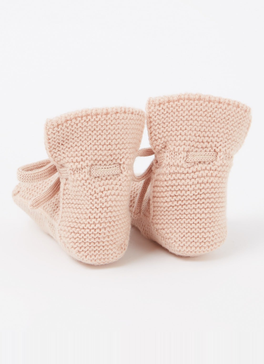 Hvid Booties gebreide babyslofjes van wol - achterkant zalmroze