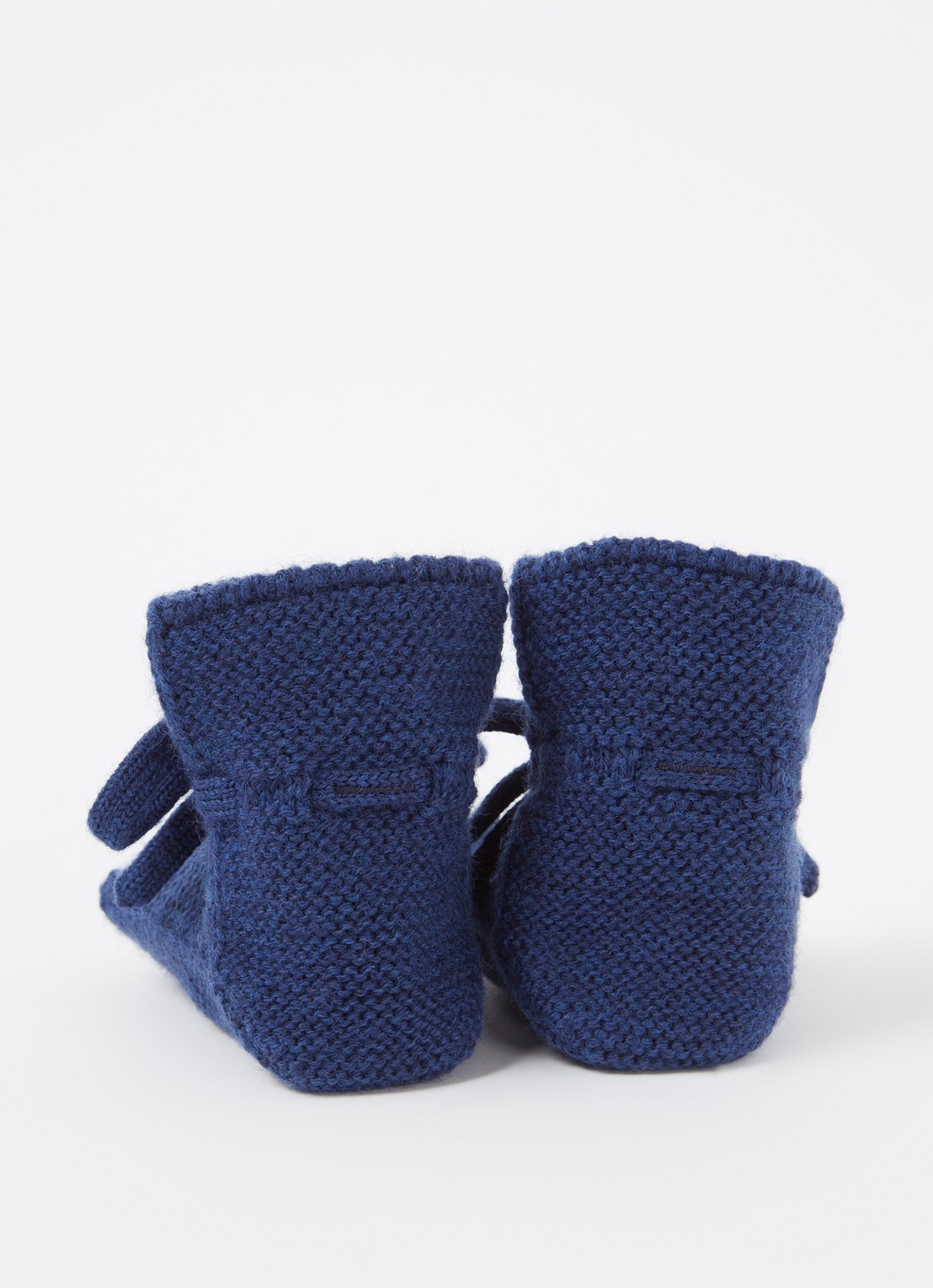 Hvid Booties gebreide babyslofjes van wol - achterkant donkerblauw
