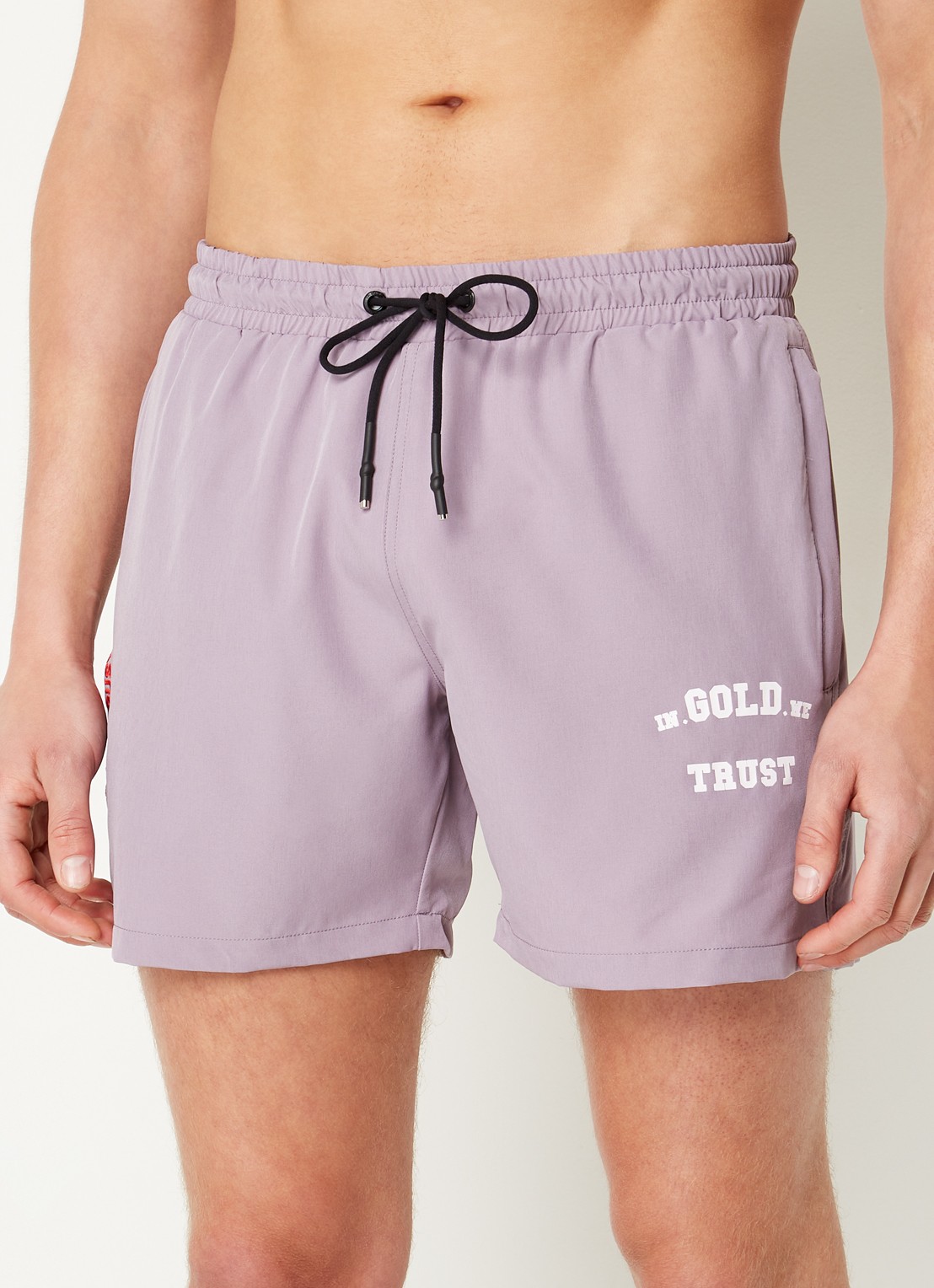In Gold We Trust The Marley zwemshorts met ritszakken en logo - detail lila