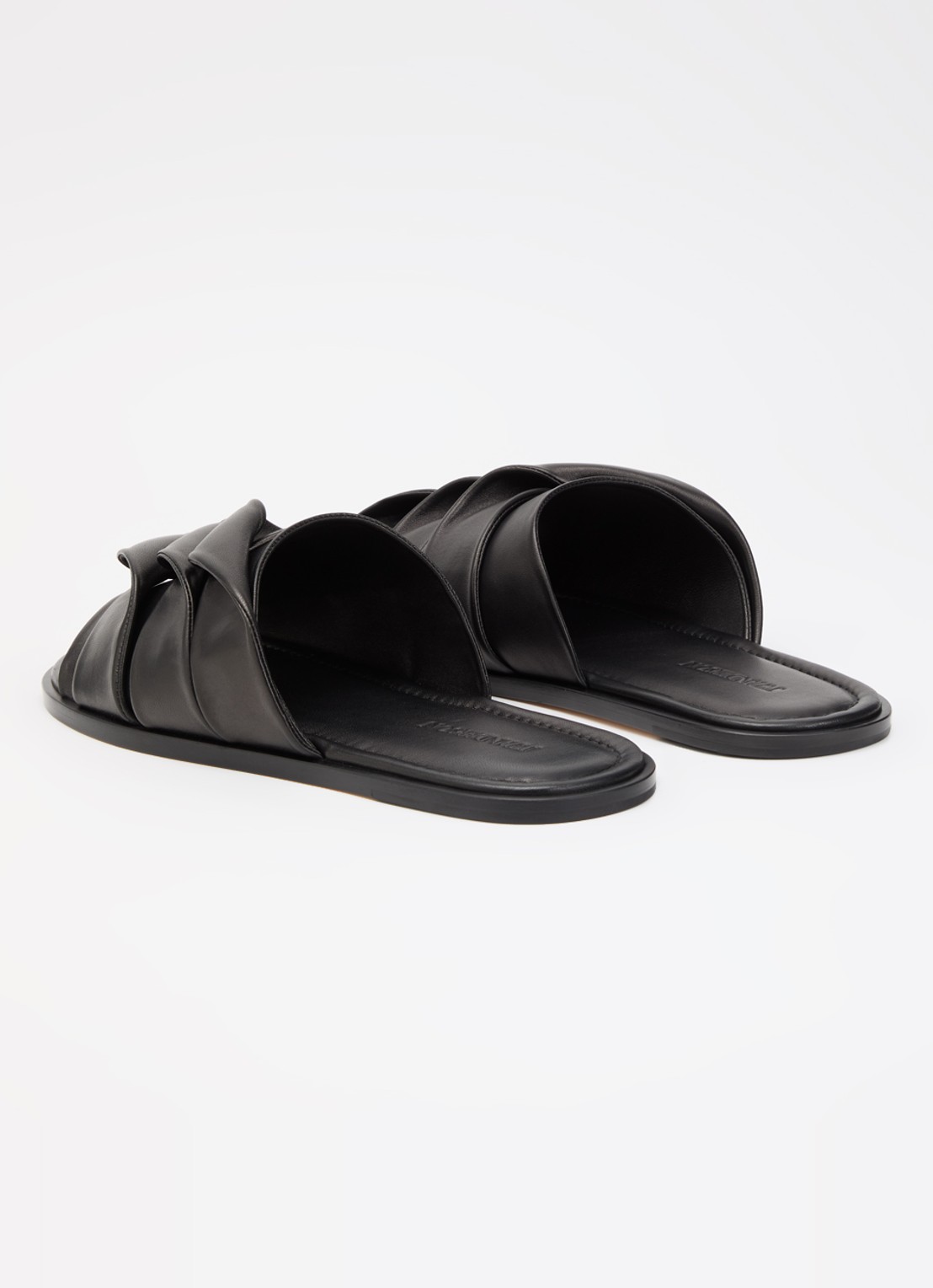 J.W. Anderson Coil slipper van leer - achterkant zwart