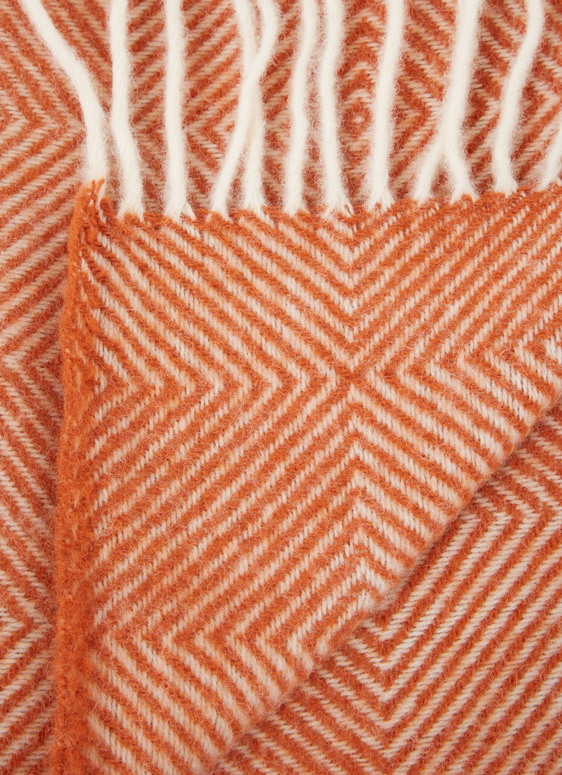 Klippan Gooseye plaid van wol 130 x 200 cm - detail donkeroranje