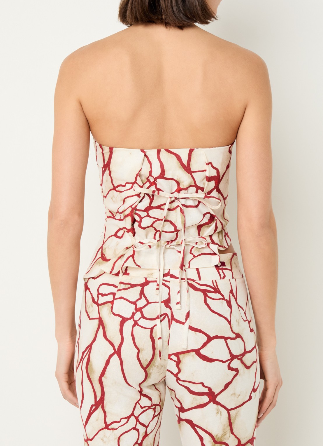 Laagam Panot strapless top in linnenblend met asymmetrische zoom - achterkant creme