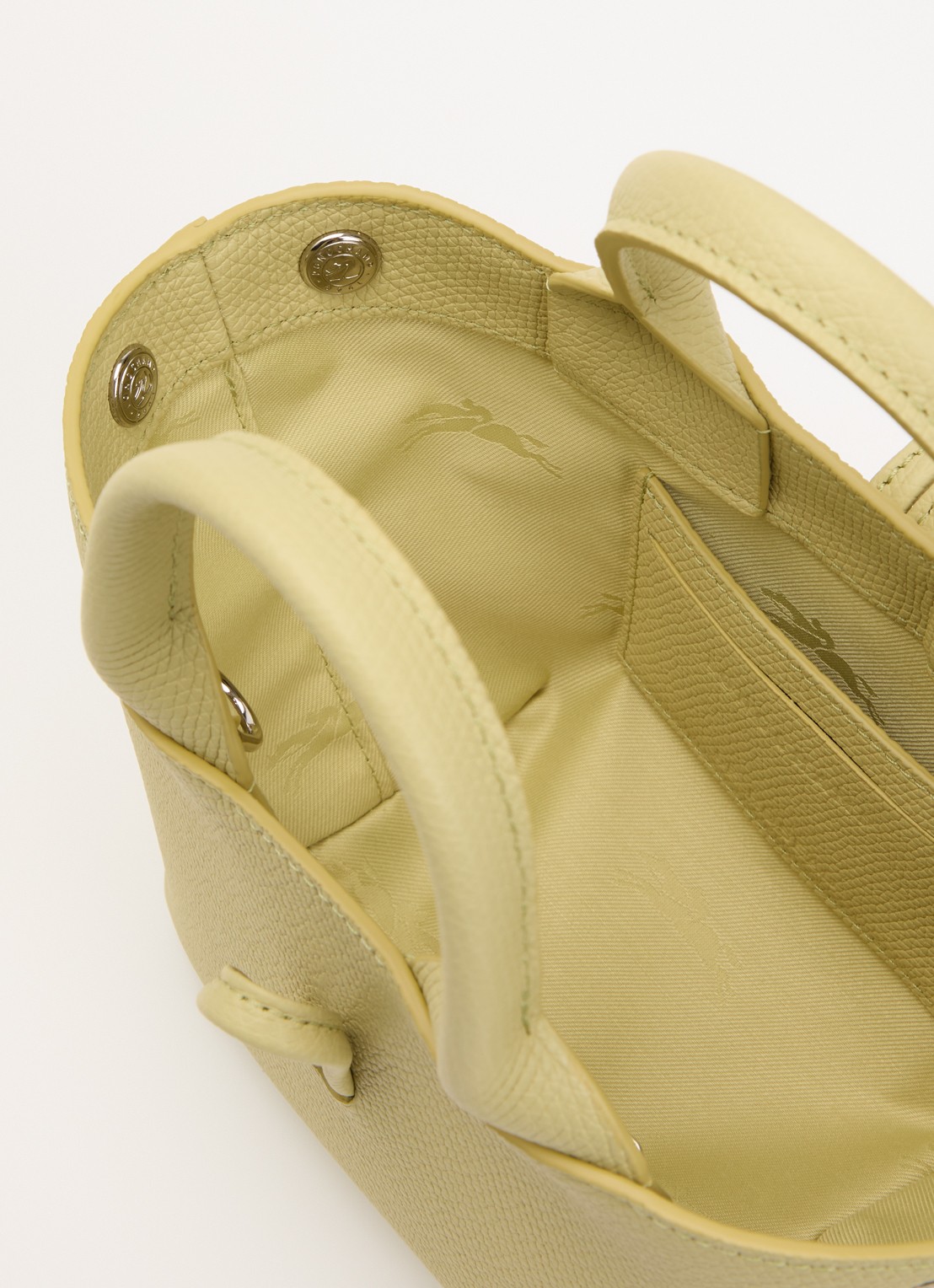 Longchamp Le Roseau handtas XS van leer - detail lichtgroen