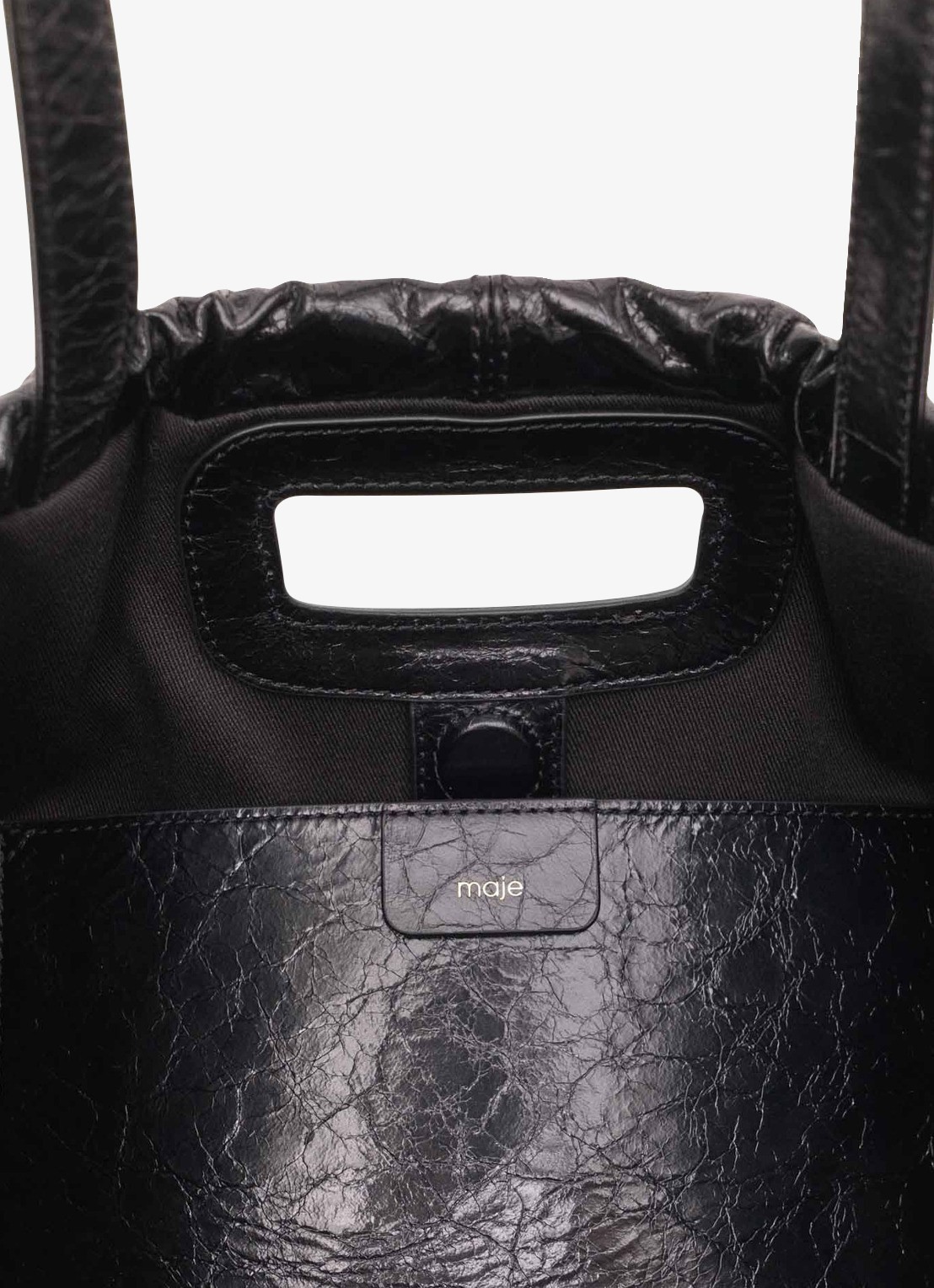 Maje Miss M Cabasused schoudertas van leer - detail jeans
