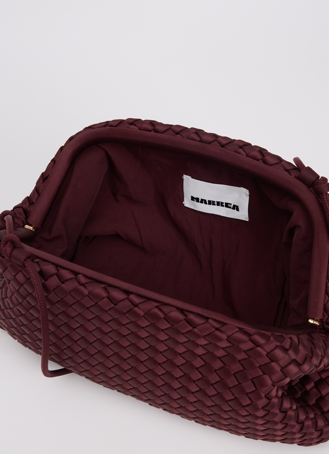 Marrea Clutch met gevlochten details en verstelbare schouderriem - detail indigo