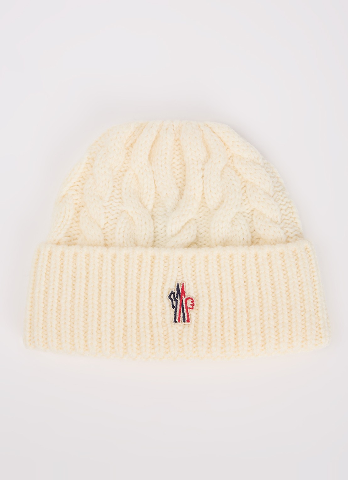 Moncler Kabelgebreide muts in scheerwolblend met logo - voorkant ivoor