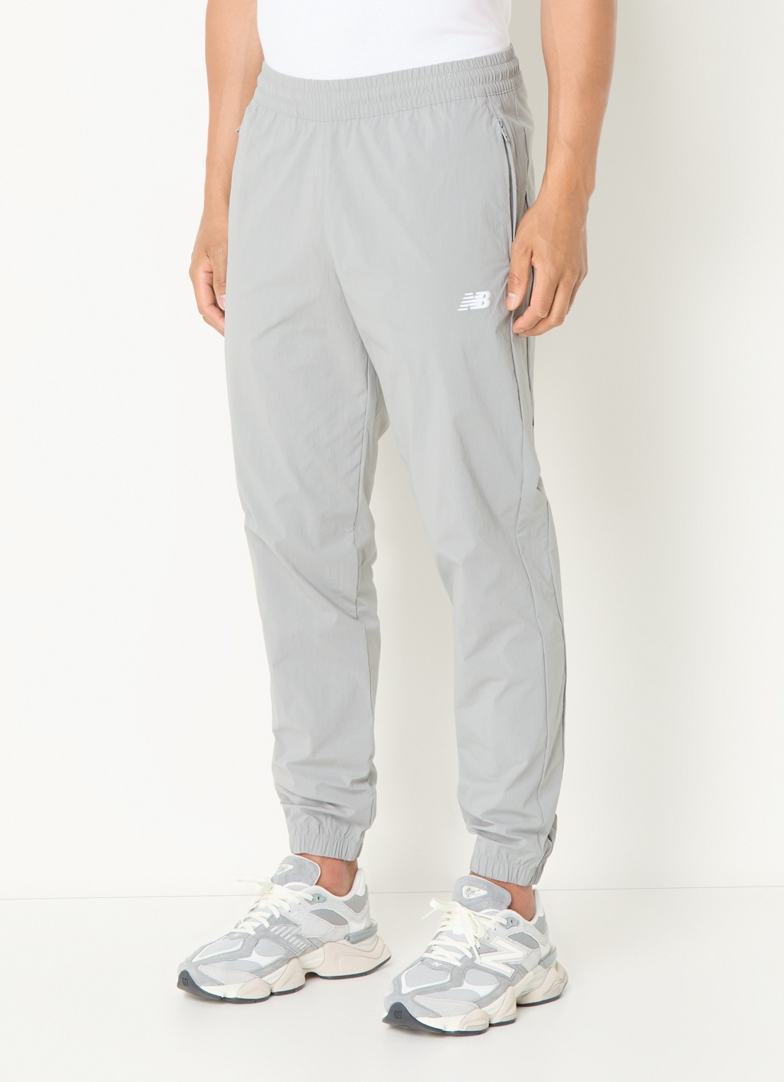 New Balance Tapered fit joggingbroek met ritszakken - detail 4 grijs