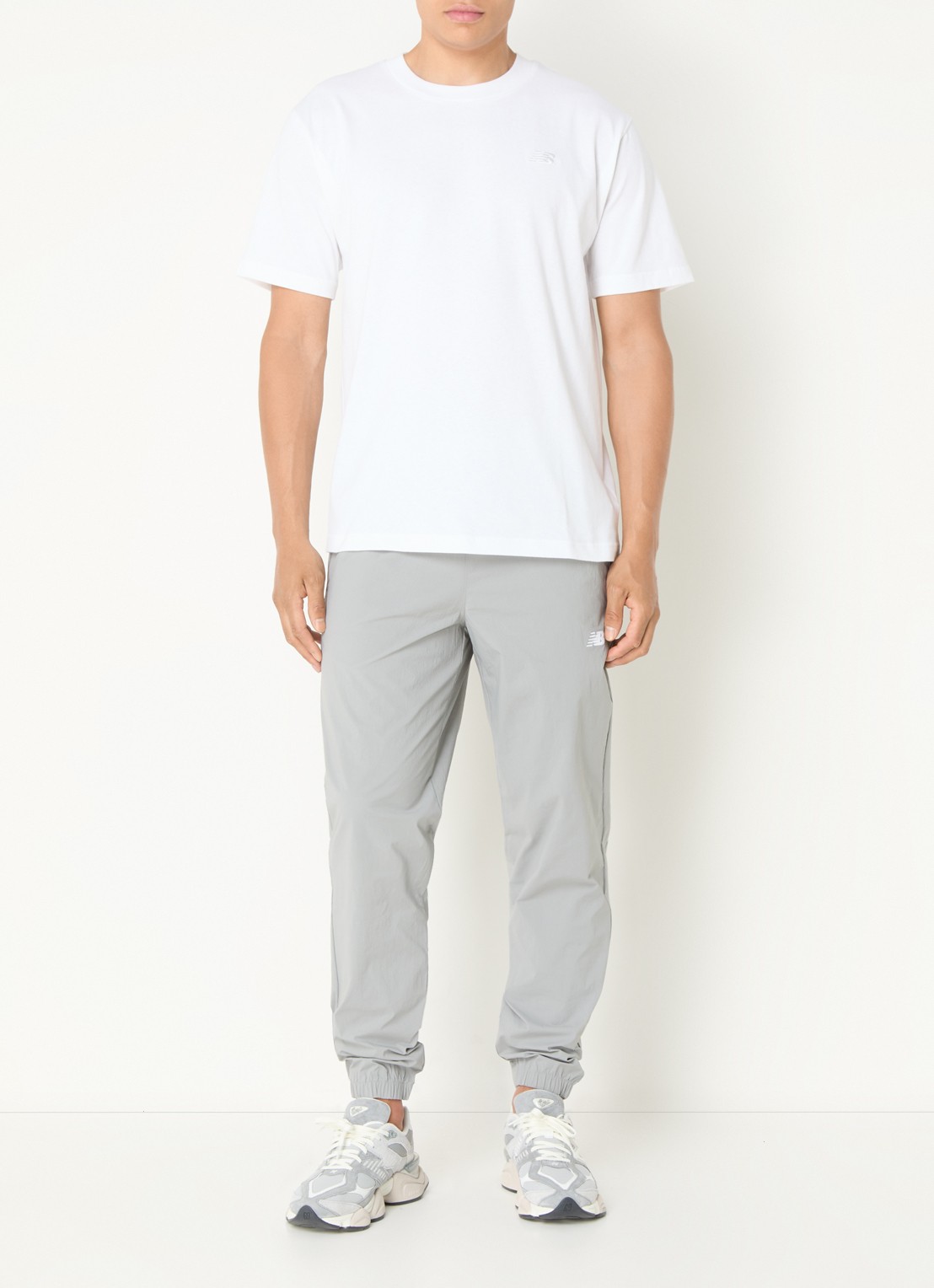 New Balance Tapered fit joggingbroek met ritszakken - voorkant 3 grijs