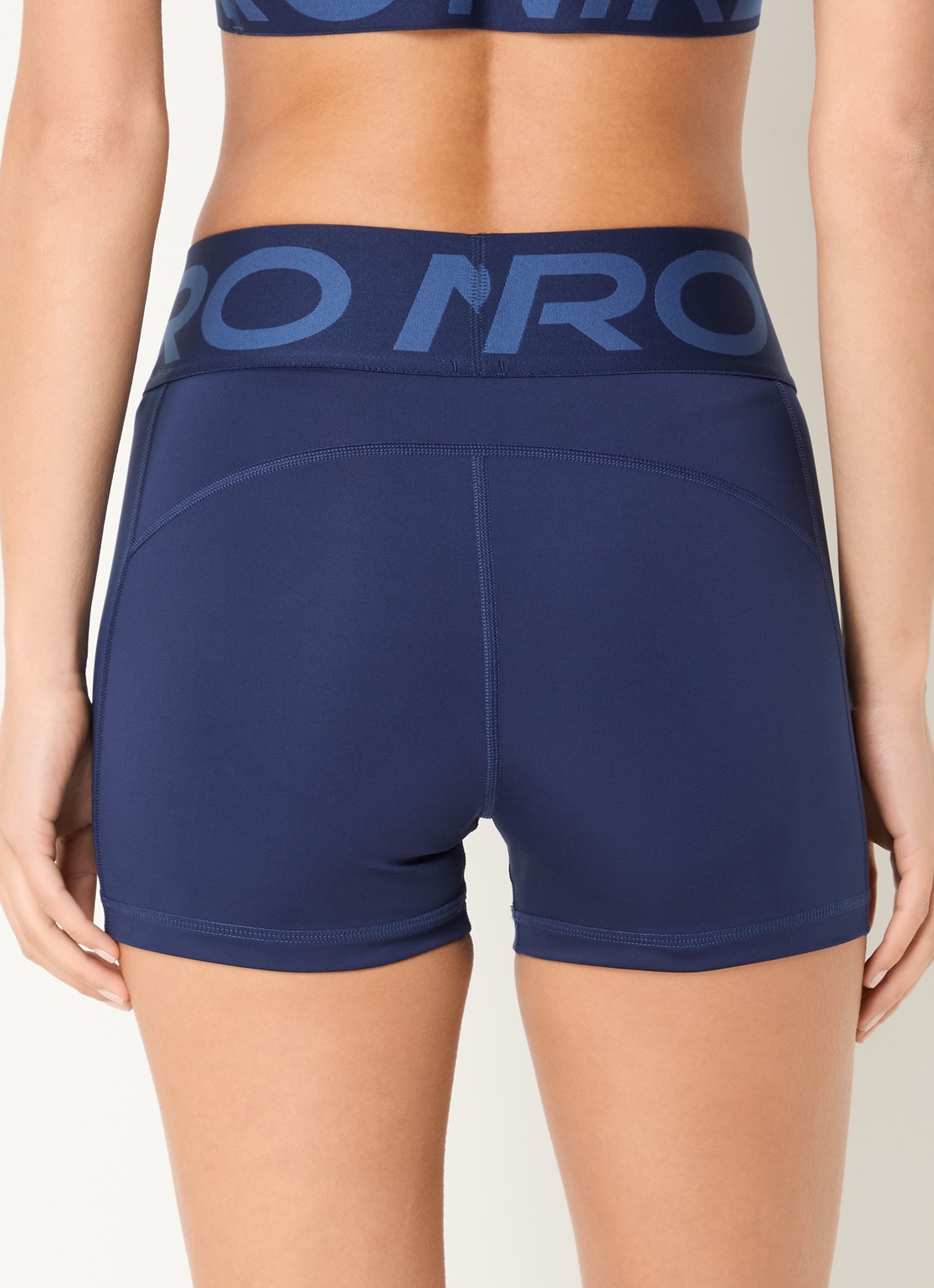 Nike Pro Sculpt high waist skinny fit fietsbroek met dri-FIT en logoband - achterkant donkerblauw