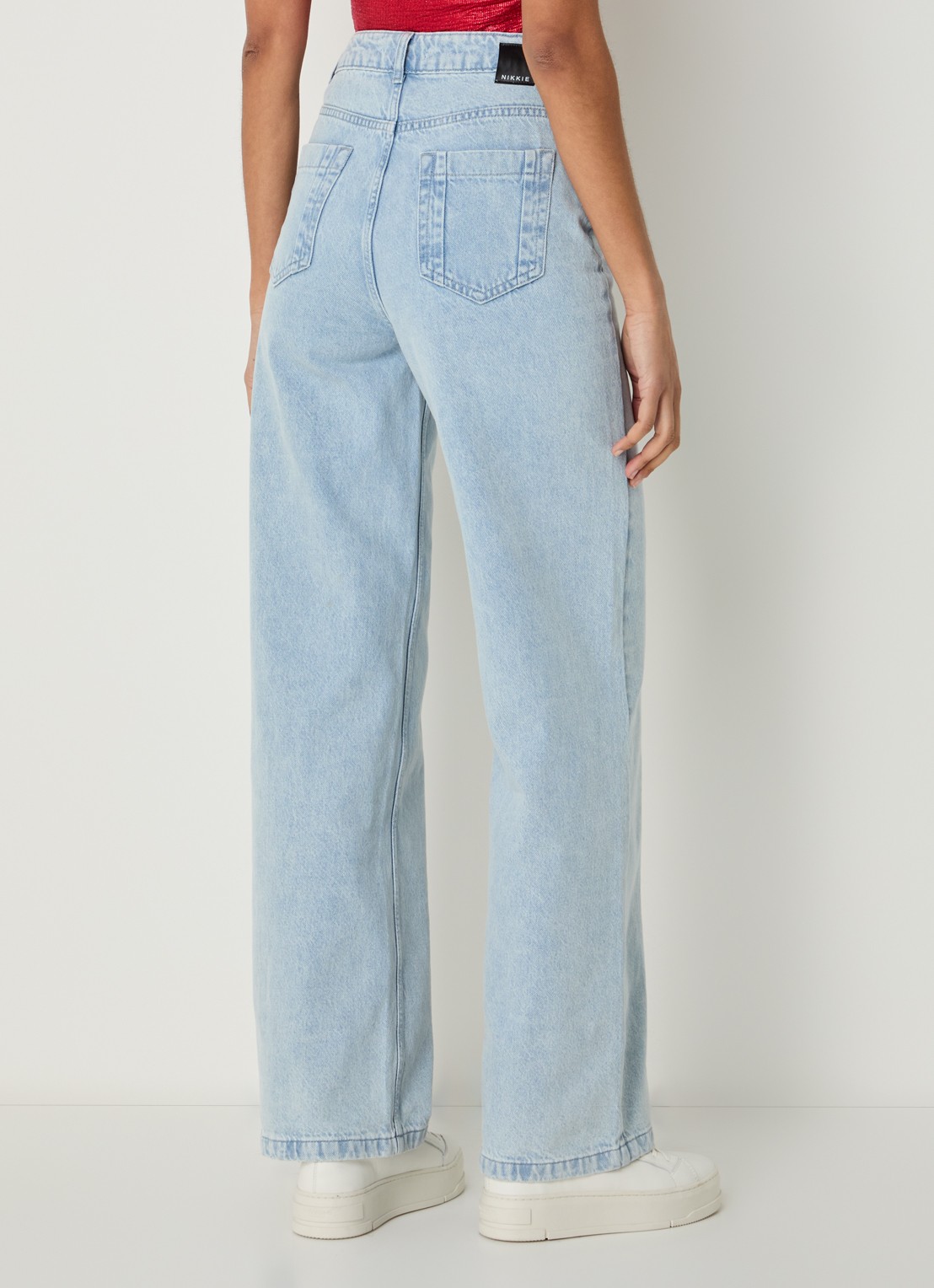 NIKKIE Erode high waist wide leg jeans met lichte wassing - achterkant indigo