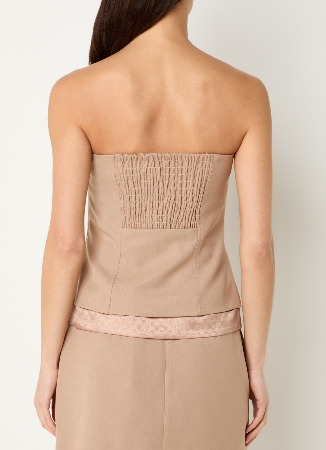NIKKIE Oakland strapless gilet met sierknopen - achterkant donkerbeige