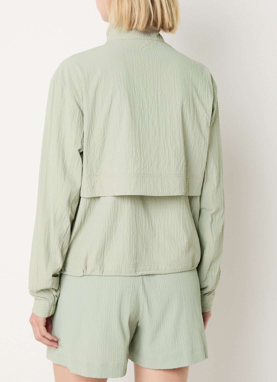 On Courtside Eaze pullover met halve rits - achterkant 4 lindegroen